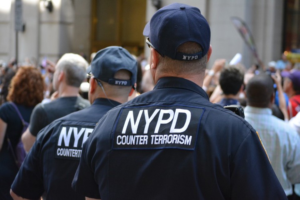 Counter terrorism officers in parade crowd are on alert for domestic terrorism threats.